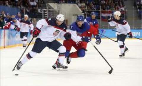 Feb 19, 2014; Sochi, RUSSIA; USA forward Zach Parise (9) controls the puck against Czech Republic defenseman Tomas Kaberle (7) in the men’s ice hockey quarterfinals during the Sochi 2014 Olympic Winter Games at Shayba Arena. Mandatory Credit: Winslow Townson-USA TODAY Sports