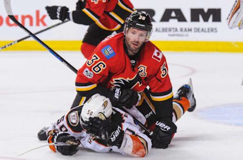 CALGARY, AB – APRIL 19: Troy Brouwer #36 of the Calgary Flames shoves Antoine Vermette #50 of the Anaheim Ducks to the ice. (Photo by Derek Leung/Getty Images)