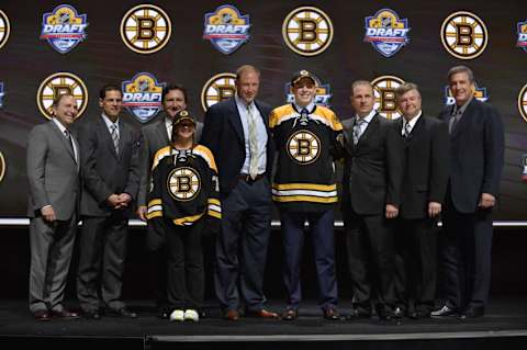 Jun 26, 2015; Sunrise, FL, USA; Jake Debrusk poses with team executives after being selected as the number fourteen overall pick to the Boston Bruins in the first round of the 2015 NHL Draft at BB&T Center. Mandatory Credit: Steve Mitchell-USA TODAY Sports