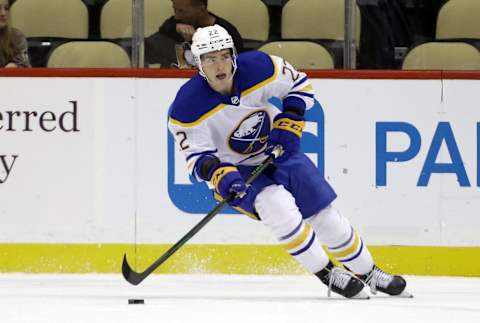 Oct 5, 2021; Pittsburgh, Pennsylvania, USA; Buffalo Sabres right wing Jack Quinn (22) skates with the puck against the Pittsburgh Penguins during the first period at PPG Paints Arena. Mandatory Credit: Charles LeClaire-USA TODAY Sports