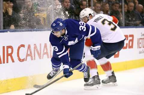 Oct 27, 2016; Toronto, Ontario, CAN; Toronto Maple Leafs center Seth Griffith (33) is knocked off balance by Florida Panthers defenseman Keith Yandle (3) at Air Canada Centre. Mandatory Credit: Tom Szczerbowski-USA TODAY Sports