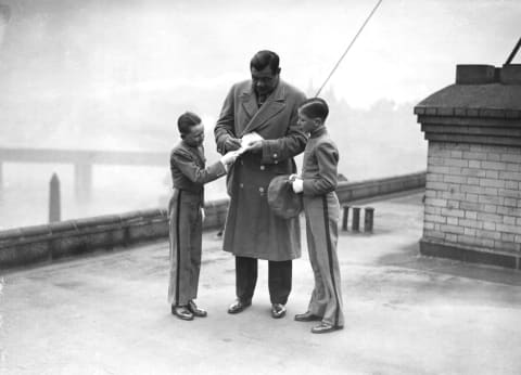 Babe Ruth signs autographs in the 1930s. Allsport Hulton/Archive