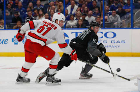 TAMPA, FL – NOVEMBER 30: Tampa Bay Lightning center Steven Stamkos (91) has his shot blocked by Carolina Hurricanes defenseman Jake Gardiner (51) during the NHL game between the Carolina Hurricanes and Tampa Bay Lightning on November 30, 2019 at Amalie Arena in Tampa, FL. (Photo by Mark LoMoglio/Icon Sportswire via Getty Images)