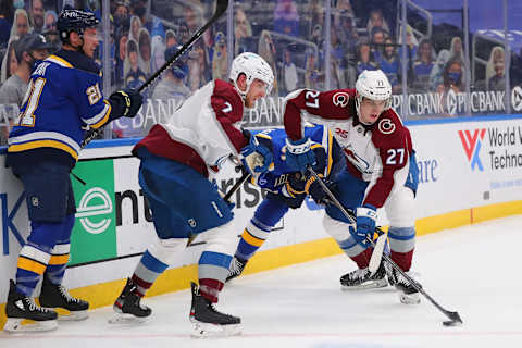 ST LOUIS, MO – APRIL 22: Ryan Graves #27 and Devon Toews #7 of the Colorado Avalanche look to clear the puck against Tyler Bozak #21 of the St. Louis Blues in the second period at Enterprise Center on April 22, 2021 in St Louis, Missouri. (Photo by Dilip Vishwanat/Getty Images)