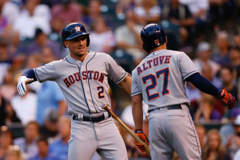 DENVER, CO – JULY 24: Alex Bregman #2 of the Houston Astros is congratulated by Jose Altuve #27 after hitting a two run home run in the first inning against the Colorado Rockies during interleague play at Coors Field on July 24, 2018 in Denver, Colorado. (Photo by Justin Edmonds/Getty Images)