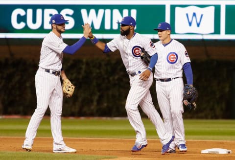 CHICAGO, IL – OCTOBER 18: Kris Bryant #17, Jason Heyward #22, and Anthony Rizzo #44 of the Chicago Cubs celebrate after beating the Los Angeles Dodgers 3-2 in game four of the National League Championship Series at Wrigley Field on October 18, 2017 in Chicago, Illinois. (Photo by Jamie Squire/Getty Images)