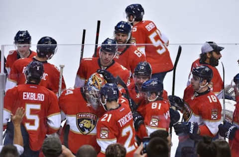 Nov 3, 2016; Sunrise, FL, USA; Florida Panthers teammates celebrate after defeating the New Jersey Devils 4-3 in overtime at the BB&T Center. Mandatory Credit: Jasen Vinlove-USA TODAY Sports