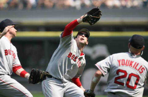 Jul 08, 2006; Chicago, IL, USA; Boston Red Sox Kevin Youkilis, Trot Nixon, Mark Loretta against Chicago White Sox at the U.S. Cellular Field. The Red Sox won 9-6. (Photo by Matthew Kutz/Sporting News via Getty Images)