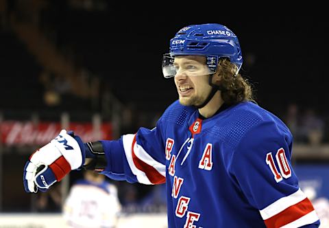 NEW YORK, NEW YORK – APRIL 25: Artemi Panarin #10 of the New York Rangers talks to his teammates during warm ups before the game against the Buffalo Sabres at Madison Square Garden on April 25, 2021 in New York City. (Photo by Elsa/Getty Images)