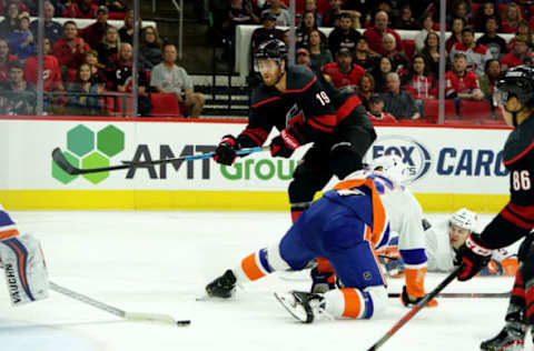 RALEIGH, NC – OCTOBER 11: Dougie Hamilton #19 of the Carolina Hurricanes passes the puck through the crease to Teuvo Teravainen #86 who scores during an NHL game against the New York Islanders on October 11, 2019 at PNC Arena in Raleigh North Carolina. (Photo by Gregg Forwerck/NHLI via Getty Images)