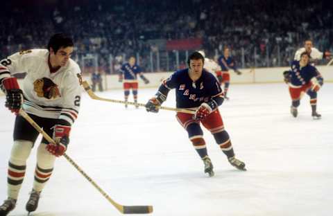 NEW YORK, NY – 1973: Rod Gilbert #7 of the New York Rangers pressures Jerry Korab #22 of the Chicago Blackhawks circa 1973 at the Chicago Stadium in Chicago, Illinois. (Photo by Melchior DiGiacomo/Getty Images)