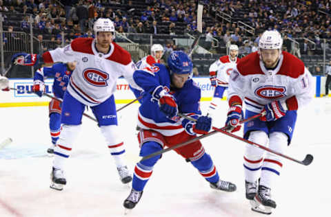 NEW YORK, NEW YORK – APRIL 27: Dryden Hunt #29 of the New York Rangers skates against Jeff Petry #26 and Josh Anderson #17 of the Montreal Canadiens at Madison Square Garden on April 27, 2022 in New York City. The Canadiens defeated the Rangers 4-3. (Photo by Bruce Bennett/Getty Images)