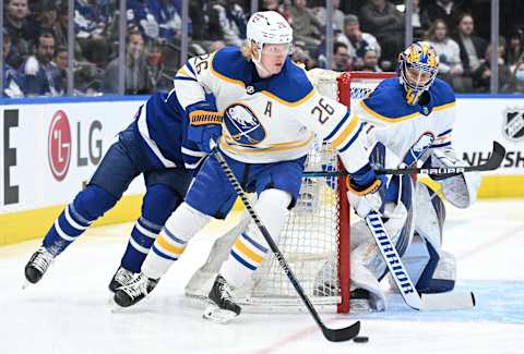 Apr 12, 2022; Toronto, Ontario, CAN; Buffalo Sabres defenseman Rasmus Dahlin (26) skates the puck out of his zone against the Toronto Maple Leafs in the first period at Scotiabank Arena. Mandatory Credit: Dan Hamilton-USA TODAY Sports