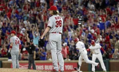 Sep 21, 2016; Arlington, TX, USA; Los Angeles Angels starting pitcher Jered Weaver (36) reacts after giving up a two run home run to Texas Rangers right fielder Carlos Beltran (36) during the fifth inning at Globe Life Park in Arlington. Mandatory Credit: Kevin Jairaj-USA TODAY Sports