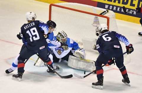 United States’ forward Clayton Keller (L) and United States’ forward Jack Hughes vie with Finland’s goalkeeper Veini Vehvilainen during the IIHF Men’s Ice Hockey World Championships Group A match between USA and Finland on May 13, 2019 in Kosice, Slovakia. (Photo by JOE KLAMAR / AFP) (Photo credit should read JOE KLAMAR/AFP/Getty Images)