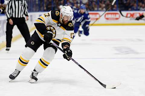 TAMPA, FLORIDA – NOVEMBER 21: Nick Foligno #17 of the Boston Bruins looks to pass during a game against the Tampa Bay Lightning at Amalie Arena on November 21, 2022, in Tampa, Florida. (Photo by Mike Ehrmann/Getty Images)