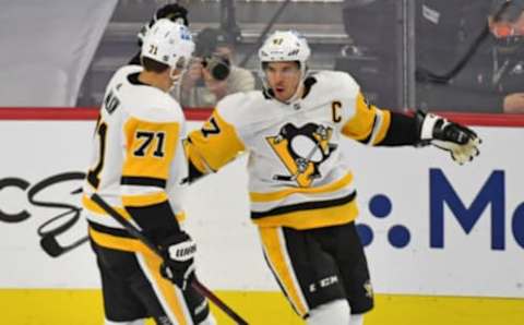 Jan 13, 2021; Philadelphia, Pennsylvania, USA; Pittsburgh Penguins center Sidney Crosby (87) celebrates his goal with Pittsburgh Penguins center Evgeni Malkin (71) against the Philadelphia Flyers during the second period at Wells Fargo Center. Mandatory Credit: Eric Hartline-USA TODAY Sports