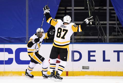 Sidney Crosby #87 of the Pittsburgh Penguins celebrates his game winning goal against Alexandar Georgiev #40 of the New York Rangers The Penguins defeated the Rangers 5-4 in overtime. Mandatory Credit: Bruce Bennett/POOL PHOTOS-USA TODAY Sports