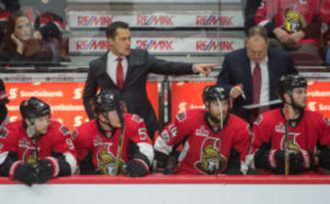 Ottawa Senators head coach Guy Boucher signals to his players (Marc DesRosiers-USA TODAY Sports)