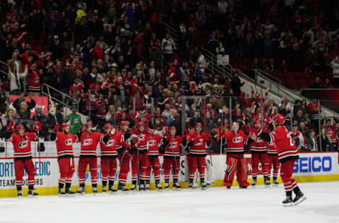 RALEIGH, NC – NOVEMBER 12: Carolina Hurricanes Center Sebastian Aho (20) leads the Carolina Hurricane players and crowd in the Storm Surge after defeating the visiting Blackhawks during a game between the Chicago Blackhawks and the Carolina Hurricanes at the PNC Arena in Raleigh, NC on November 12, 2018. (Photo by Greg Thompson/Icon Sportswire via Getty Images)