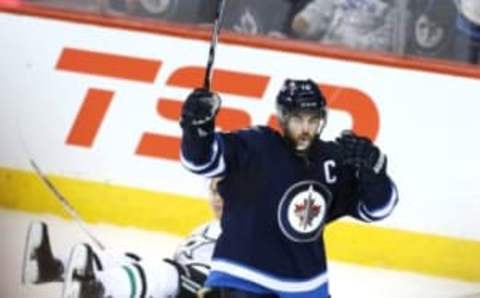 Feb 23, 2016; Winnipeg, Manitoba, CAN; Winnipeg Jets left wing Andrew Ladd (16) celebrates after scoring a goal against the Dallas Stars during the second period at MTS Centre. Mandatory Credit: Bruce Fedyck-USA TODAY Sports