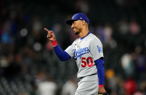 Jul 28, 2022; Denver, Colorado, USA; Los Angeles Dodgers right fielder Mookie Betts (50) celebrates defeating the Colorado Rockies at Coors Field. Mandatory Credit: Ron Chenoy-USA TODAY Sports