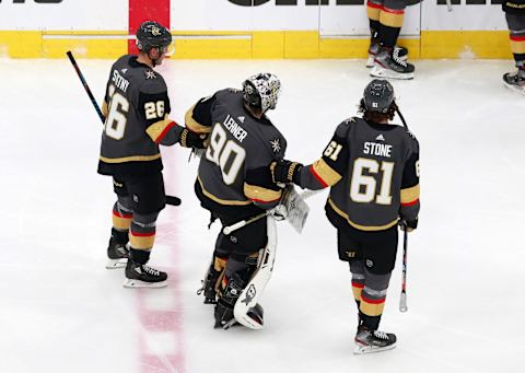 Robin Lehner #90 of the Vegas Golden Knights is helped to the bench by teammates Paul Stastny #36 and Mark Stone#61 after loosing a skate blade against the Chicago Blackhawks during the second period in Game One of the Western Conference First Round. (Photo by Jeff Vinnick/Getty Images)