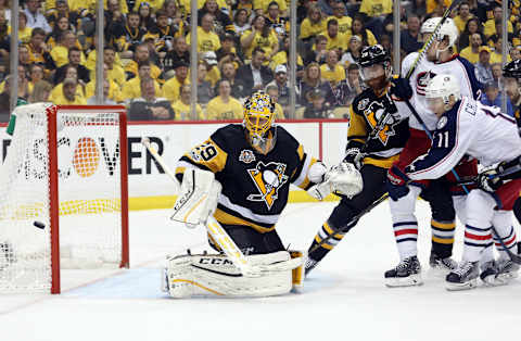 Apr 20, 2017; Pittsburgh, PA, USA; Columbus Blue Jackets left wing Matt Calvert (11) shoots the puck wide of Pittsburgh Penguins goalie Marc-Andre Fleury (29) during the third period in game five of the first round of the 2017 Stanley Cup Playoffs at PPG PAINTS Arena. The Pens won the game 5-2 and the series 4 games to 1. Mandatory Credit: Charles LeClaire-USA TODAY Sports