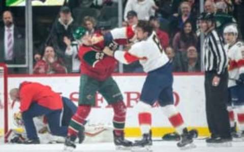 Dec 13, 2016; Saint Paul, MN, USA; Minnesota Wild forward Kurtis Gabriel (63) fights with Florida Panthers defenseman Dylan McIlrath (8) during the first period at Xcel Energy Center. Mandatory Credit: Brace Hemmelgarn-USA TODAY Sports