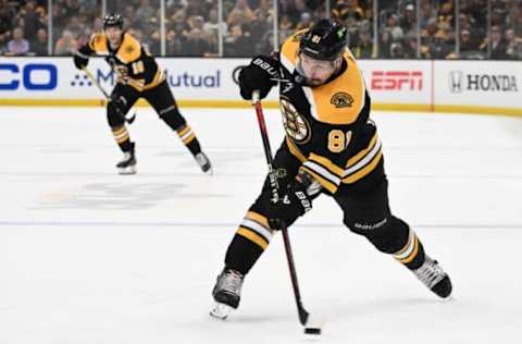 Apr 17, 2023; Boston, Massachusetts, USA; Boston Bruins defenseman Dmitry Orlov (81) takes a shot against the Florida Panthers during the third period of game one of the first round of the 2023 Stanley Cup Playoffs at TD Garden. Mandatory Credit: Brian Fluharty-USA TODAY Sports