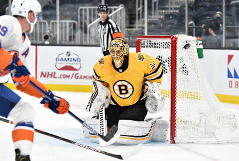 Apr 15, 2021; Boston, Massachusetts, USA; Boston Bruins goaltender Tuukk Rask (40) deflects the puck in the corner during the first period against the New York Islanders at TD Garden. Mandatory Credit: Bob DeChiara-USA TODAY Sports