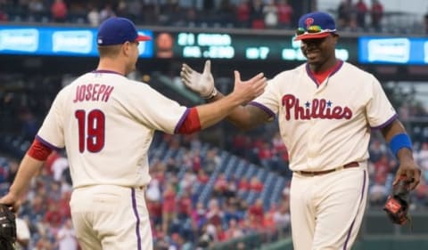 Even Though Joseph Couldn’t Continue Catching, He Receives the Torch from Howard After Game 162. Photo by Bill Streicher – USA TODAY Sports.