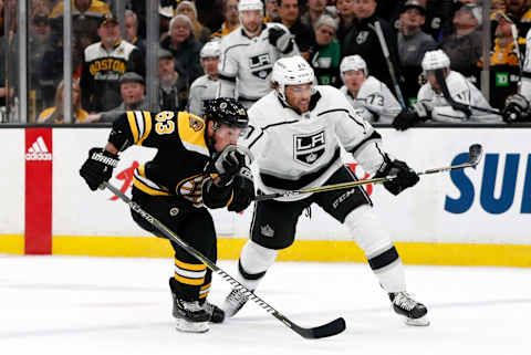 BOSTON, MA – FEBRUARY 09: Los Angeles Kings left wing Alex Iafallo (19) interest with Boston Bruins left wing Brad Marchand (63) during a game between the Boston Bruins and the Los Angeles Kings on February 9, 2019, at TD Garden in Boston, Massachusetts. (Photo by Fred Kfoury III/Icon Sportswire via Getty Images)