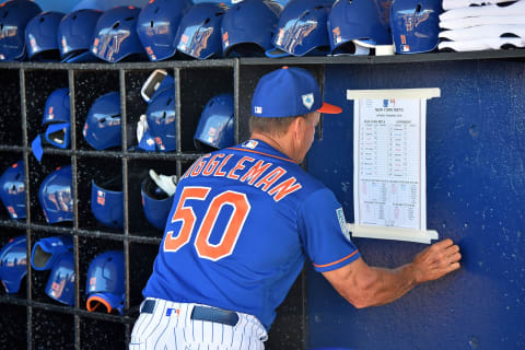 Feb 23, 2019; Port St. Lucie, FL, USA; New York Mets bench coach Jim Riggleman (50) hangs a lineup card in the dugout prior to the game against the Atlanta Braves at First Data Field. Mandatory Credit: Jasen Vinlove-USA TODAY Sports