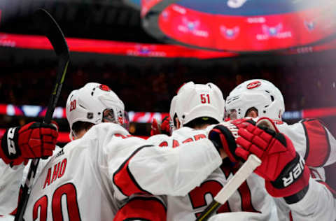 WASHINGTON, DC – OCTOBER 05: Jake Gardiner #51 of the Carolina Hurricanes celebrates with his teammates after scoring the game winning goal in overtime against the Washington Capitals at Capital One Arena on October 5, 2019 in Washington, DC. (Photo by Patrick McDermott/NHLI via Getty Images)