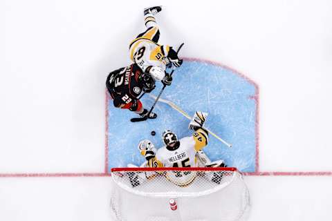 ANAHEIM, CALIFORNIA – NOVEMBER 07: Erik Karlsson #65 and Magnus Hellberg #45 of the Pittsburgh Penguins defend against Mason McTavish #23 of the Anaheim Ducks during the third period of a game at Honda Center on November 07, 2023 in Anaheim, California. (Photo by Sean M. Haffey/Getty Images)