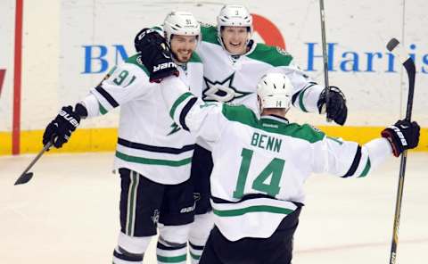 Nov 28, 2015; Saint Paul, MN, USA; Dallas Stars forward Jamie Benn (14) (front) and defenseman John Klingberg (3) (center) congratulate forward Tyler Seguin (91) on his game winning goal against the Minnesota Wild during overtime at Xcel Energy Center. The Starts win 4-3 over the Wild in overtime. Mandatory Credit: Marilyn Indahl-USA TODAY Sports