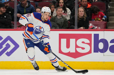 CHICAGO, ILLINOIS - NOVEMBER 30: Philip Broberg #86 of the Edmonton Oilers skates with the puck against the Chicago Blackhawks during the third period at United Center on November 30, 2022 in Chicago, Illinois. (Photo by Patrick McDermott/Getty Images)