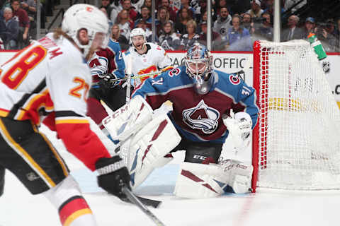 DENVER, CO – APRIL 17: Goaltender Philipp Grubauer #31 of the Colorado Avalanche looks to make a save against Elias Lindholm #28 of the Calgary Flames in Game Four of the Western Conference First Round during the 2019 NHL Stanley Cup Playoffs at the Pepsi Center on April 17, 2019 in Denver, Colorado. (Photo by Michael Martin/NHLI via Getty Images)