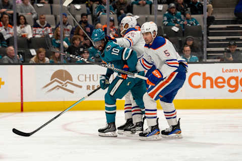 Nov 9, 2023; San Jose, California, USA; Edmonton Oilers defenseman Darnell Nurse (25) and Edmonton Oilers defenseman Cody Ceci (5) and San Jose Sharks left wing Anthony Duclair (10) battle for position in front of the net during the second period at SAP Center at San Jose. Mandatory Credit: Neville E. Guard-USA TODAY Sports