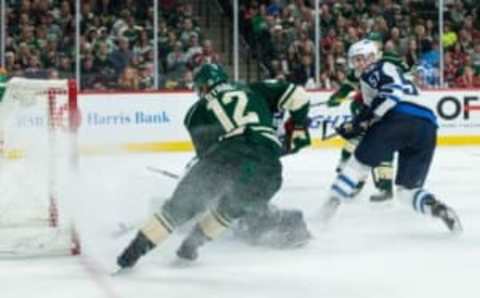 Oct 15, 2016; Saint Paul, MN, USA; Minnesota Wild forward Eric Staal (12) scores a goal during the second period against the Winnipeg Jets at Xcel Energy Center. Mandatory Credit: Brace Hemmelgarn-USA TODAY Sports