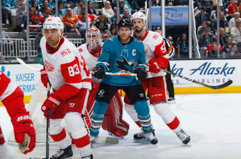 SAN JOSE, CA – MARCH 12: Joe Pavelski #8 of the San Jose Sharks battles for position against Jimmy Howard #35 and Jonathan Ericsson #52 of the Detroit Red Wings at SAP Center on March 12, 2018 in San Jose, California. (Photo by Rocky W. Widner/NHL/Getty Images)