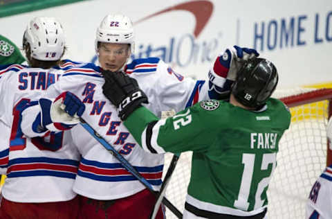 Dec 15, 2016; Dallas, TX, USA; New York Rangers defenseman Nick Holden (22) fights with Dallas Stars center Radek Faksa (12) during the first period at the American Airlines Center. Mandatory Credit: Jerome Miron-USA TODAY Sports