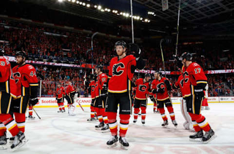 CALGARY, AB – MARCH 31: Teammates of the Calgary Flames celebrate a playoff clinching win against the San Jose Sharks after an NHL game on March 31, 2017 at the Scotiabank Saddledome in Calgary, Alberta, Canada. (Photo by Gerry Thomas/NHLI via Getty Images)