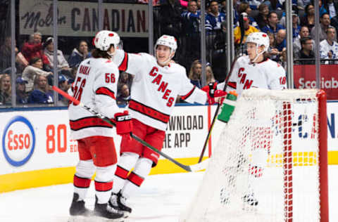 TORONTO, ON – DECEMBER 23: Martin Necas #88 of the Carolina Hurricanes celebrates his second goal against the Toronto Maple Leafs with teammates Erik Haula #56 and Ryan Dzingel #18 during the second period at the Scotiabank Arena on December 23, 2019 in Toronto, Ontario, Canada. (Photo by Mark Blinch/NHLI via Getty Images)