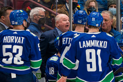 Feb 21, 2022; Vancouver, British Columbia, CAN; Vancouver Canucks head coach Bruce Boudreau gives instructions from the bench against the Seattle Kraken in the third period at Rogers Arena. Canucks won 5-2. Mandatory Credit: Bob Frid-USA TODAY Sports