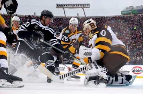 SOUTH BEND, INDIANA – JANUARY 01: Brandon Saad #20 of the Chicago Blackhawks attempts a shot past Tuukka Rask #40 of the Boston Bruins in the second period during the 2019 Bridgestone NHL Winter Classic at Notre Dame Stadium on January 01, 2019, in South Bend, Indiana. (Photo by Gregory Shamus/Getty Images)