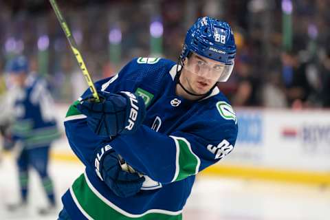 Nils Aman warming up for the Vancouver Canucks before a game against the Los Angeles Kings. (Photo by Rich Lam/Getty Images)