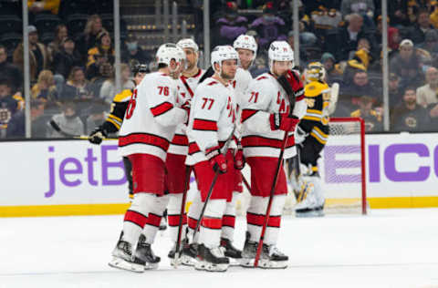 BOSTON, MA – FEBRUARY 10: Jordan Staal #11 of the Carolina Hurricanes celebrates his goal against the Boston Bruins during the third period with his teammates Brady Skjei #76, Tony DeAngelo #77, Jesper Fast #71, and Nino Niederreiter #21 at the TD Garden on February 10, 2022, in Boston, Massachusetts. The Hurricanes won 6-0. (Photo by Rich Gagnon/Getty Images)