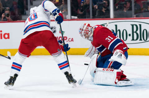 MONTREAL, QC – DECEMBER 01: Montreal Canadiens goalie Carey Price (31) stops a shot from New York Rangers left wing Chris Kreider (20) during the New York Rangers versus the Montreal Canadiens game on December 1, 2018, at Bell Centre in Montreal, QC (Photo by David Kirouac/Icon Sportswire via Getty Images)